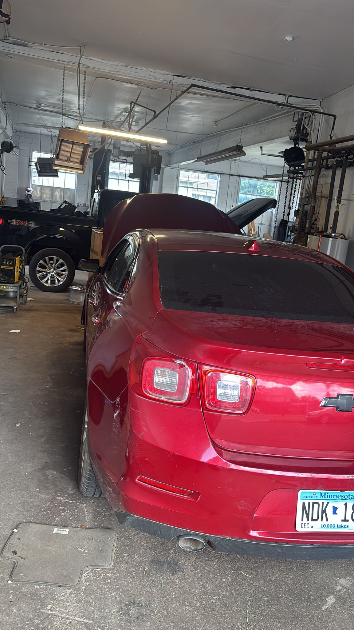 Expert mechanics working on vehicle